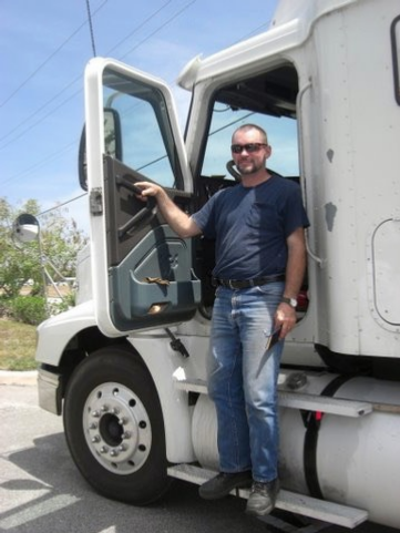 Charles Van Deursen and one of the semi tractor-trailers  that he drove. www.InTuneWithYou.com
