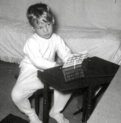 Charles Van Deursen Playing a Toy Piano at the age of Three, www.InTuneWithYou.com