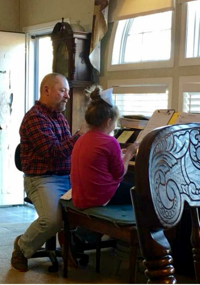 Charles Van Deursen Giving Private Piano Lesson to a Second Grade Girl, by Jimmy Griffith, www.InTuneWithYou.com