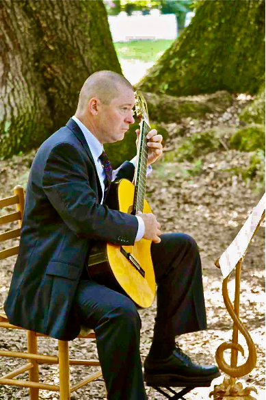 Charles Van Deursen Playing Classical Guitar in the Woods, www.InTuneWithYou.com