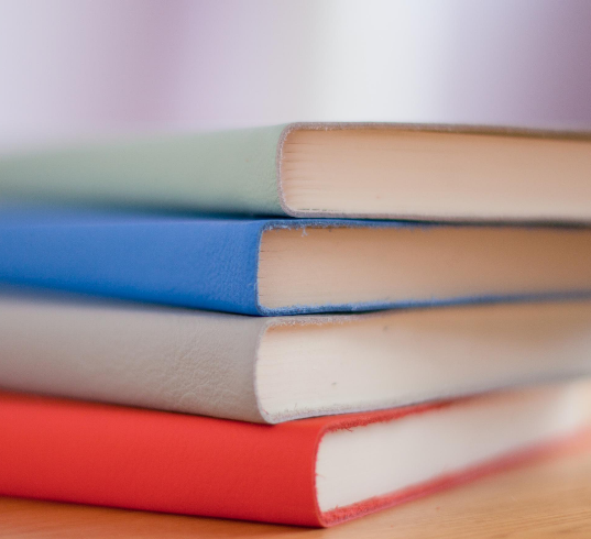 Stack of Four Books Photo by Hope House Press - Leather Diary Studio on Unsplash